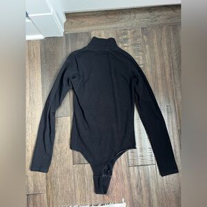 Black long sleeve turtleneck bodysuit